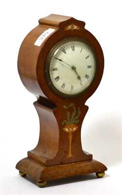 Lot 319 - An Edwardian pewter, satin wood and mother of pearl inlaid mahogany balloon form mantel clock