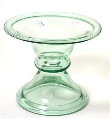 Lot 326 - A green tinted glass ham stand, 19th century of hollow bobbin form with folded rims, 19.5cm high