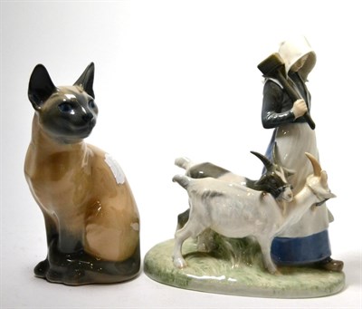 Lot 332 - Two Royal Copenhagen china groups, girl with goats and Siamese cat