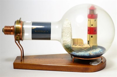 Lot 337 - A 100V, 2250W lighthouse lamp, containing a model of The Needles lighthouse, made by a Trinity...