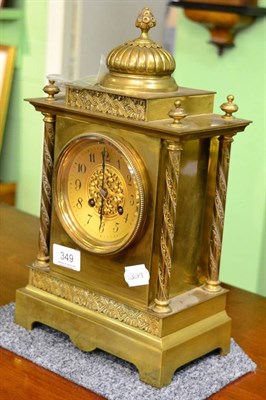 Lot 349 - A late 19th century brass mantel clock