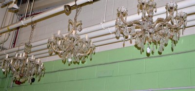 Lot 361 - Two Georgian style glass and lustre drop eight light chandeliers, together with a twelve light...