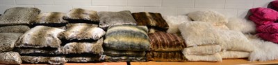 Lot 1007 - Sixty assorted faux fur and animal print cushions including Jonelle