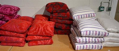 Lot 1009 - Thirteen red shot silk cushions, eight purple and white striped Designers Guild cushions, eight...