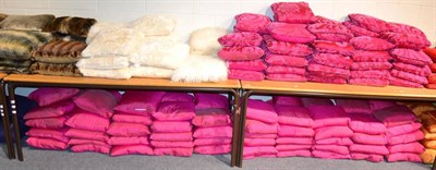 Lot 1013 - Approximately eighty nine pink shot silk cushions (qty)