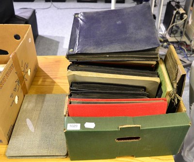 Lot 1029 - A quantity of postcard albums in one box