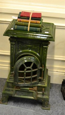 Lot 1037 - A green ceramic stove