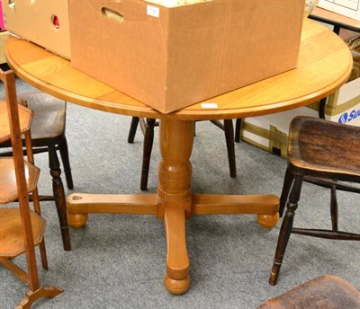 Lot 1102 - An Old Mill Furniture Knight family oak circular dining table, on a turned column, on four supports