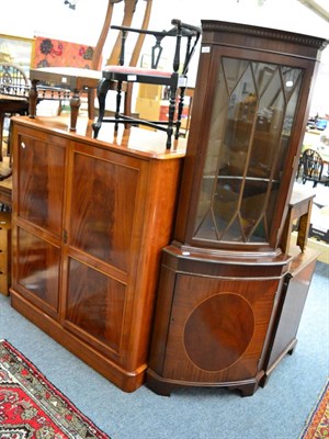 Lot 1124 - A corner cupboard and a TV cabinet