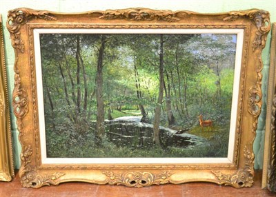 Lot 1186 - Max Hoenow (German 1851-1909) a deer in a wooded glade, signed, oil on canvas, 40.5cm by 56.5cm