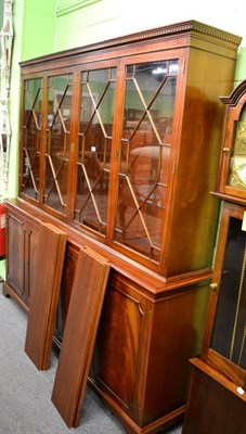 Lot 1204 - A reproduction glazed mahogany four door bookcase