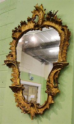 Lot 1206 - A 19th century carved giltwood mirror