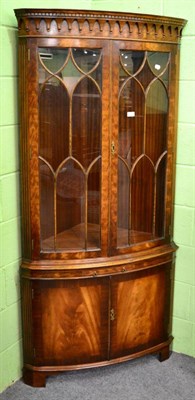 Lot 1211 - Reproduction glazed mahogany floor standing corner cupboard