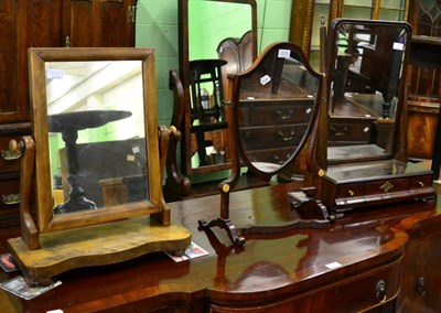 Lot 1219 - A 19th Century mahogany shield-shaped toilet mirror and two other toilet mirrors (3)