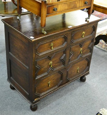 Lot 1237 - A Jacobean style oak chest of drawers with geometric mouldings