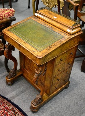 Lot 1242 - A Victorian figured walnut and marquetry inlaid Davenport, on foliate carved cabriole front...