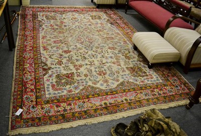 Lot 1268 - Kirman Carpet, East Iran, the ivory field with floral vines enclosed by candy pink borders,...