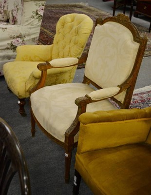 Lot 1279 - A Victorian button-back nursing chair and a French carved fauteuil (2)