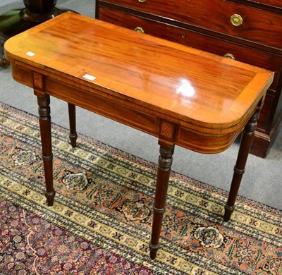 Lot 1281 - A 19th century cross banded satin wood tea table