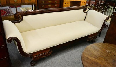 Lot 1288 - A 19th Century carved mahogany claw feet sofa