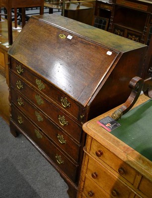 Lot 1295 - A George III oak bureau