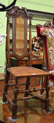 Lot 1302 - A walnut cane chair