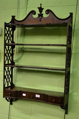 Lot 1323 - A George III style mahogany hanging wall shelf