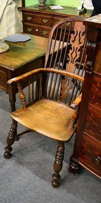 Lot 1328 - A 19th century yew and oak Windsor armchair