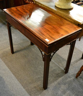 Lot 1334 - A 19th century fold over mahogany tea table