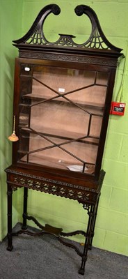 Lot 1336 - A 19th Century Chinese Chippendale style mahogany glazed display cabinet on stand, pierced...