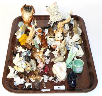 Lot 19 - A large collection of miniature ceramic rabbits, including Wade, Goebel and Sylvac examples...