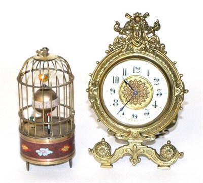 Lot 20 - A brass strut clock together with a bird cage automaton