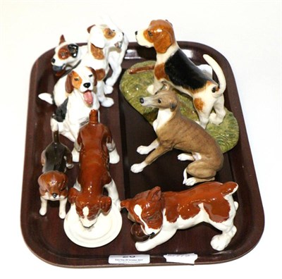 Lot 28 - Royal Doulton hounds, Beswick hounds and a model of a whippet (8)