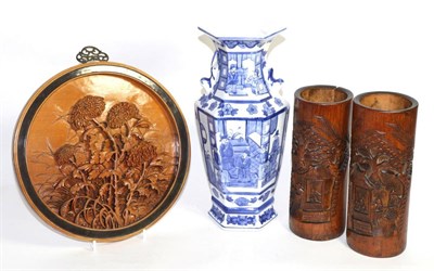 Lot 45 - A pair of Chinese carved bamboo brush pots, a blue and white hexagonal vase and a carved roundel