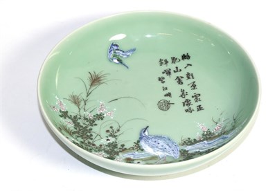 Lot 51 - A Chinese celadon dish, painted with birds amongst plants, with inscription
