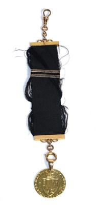 Lot 74 - A George III gold spade Guinea on a black silk and gold mounted ribbon