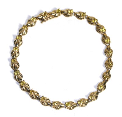 Lot 81 - A 9 carat gold yellow sapphire bracelet