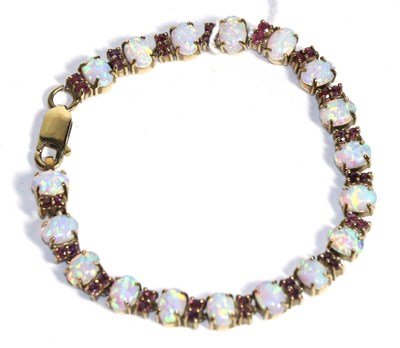 Lot 82 - A garnet and opal bracelet