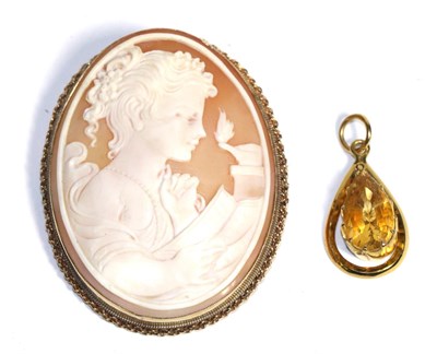 Lot 83 - A citrine pendant and a shell cameo brooch