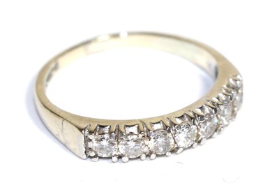 Lot 86 - An 18 carat white gold diamond half hoop ring, total estimated diamond weight 0.50 carat...