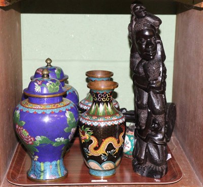 Lot 123 - Two pairs of cloisonne vases, opium multi-coloured pipe bottle and two tribal carved ebony figures