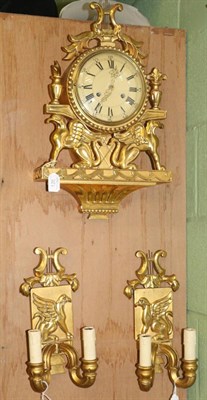 Lot 126 - A gilt wooden striking wall clock with garniture