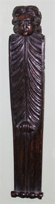 Lot 144 - A French oak Term figure, 17th century, as the head of a man on a leaf capped volute scroll,...