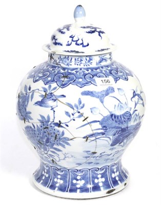 Lot 156 - A Chinese porcelain blue and white jar painted with lotus and other flowers, associated cover,...