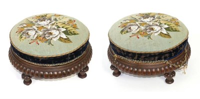 Lot 163 - A pair of 19th century carved mahogany circular footstools, with embroidered bead work upholstery