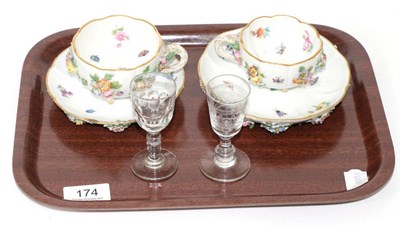 Lot 174 - Two 20th century Meissen cups and saucers together with two etched glass liqueurs