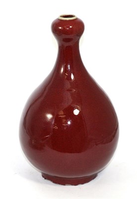 Lot 207 - A Chinese sang de boeuf bottle vase, bearing four character mark to base 34cm in height