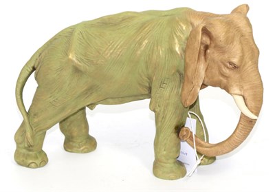 Lot 215 - A Royal Dux style porcelain figure of an elephant, early 20th century, standing four square...