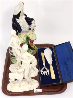 Lot 217 - Two cream glazed Sitzendorf figures (both a.f.), together with a Staffordshire figure of Will Watch