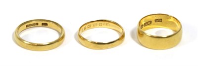 Lot 231 - Three 22 carat gold band rings